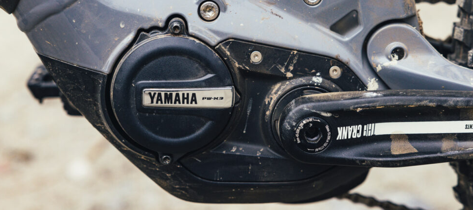 Close-up of a Yamaha e-bike motor and crank area on a modern electric mountain bike